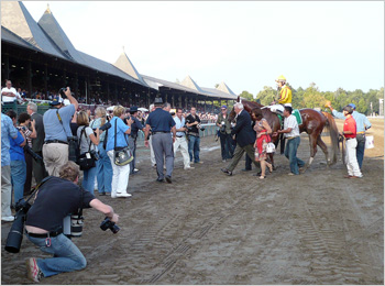 Curlin returns to the winner's circle after the Woodward